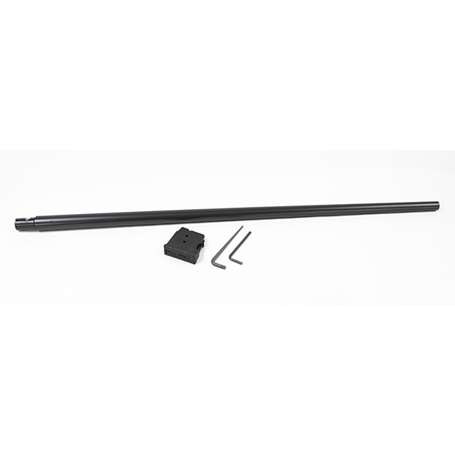 A lengthy, cylindrical black steel rod from the CZ 457 American Barrel Set in 22WMR with a nitride finish is positioned horizontally on a white surface. Alongside it are two hex keys and a small black rectangular component displaying "Shaw Barrels," ideal