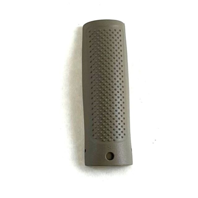 The CZ BACKSTRAP P-10 F FDE SMALL is characterized by its textured, elongated grip in a light olive-green hue, adorned with a pattern of small, evenly spaced dots. It features a smooth edge and two holes at each end and is displayed against a plain white