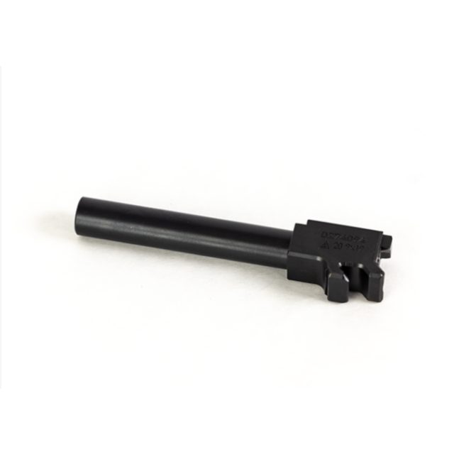A black, cylindrical metal component resembling the CZ P-10 F BARREL 9MM with a rectangular, notched base is placed on a white surface. The base features engraved numbers and markings typical of this model.