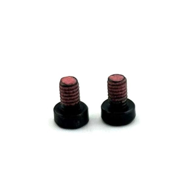 Two NOCTURNE M4 SCREW for OR COVER fasteners, black with flat heads, partially threaded shafts, and a pink coating, stand upright against a white background.