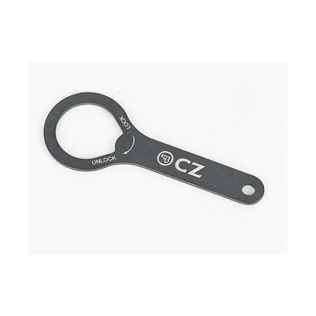 A flat, circular metal tool with a handle, branded with the product name "BARREL BUSHING WRENCH SHADOW 2 ORANGE," displaying the letters "CZ" and the words "LOCK" and "UNLOCK" accompanied by directional arrows. The background is plain white.