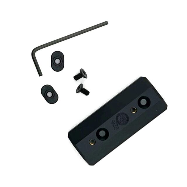 A Shadow 2 Target Add-On Weight 100g with mounting plate, two screws, two small oval washers, and an L-shaped hex key displayed on a white background.