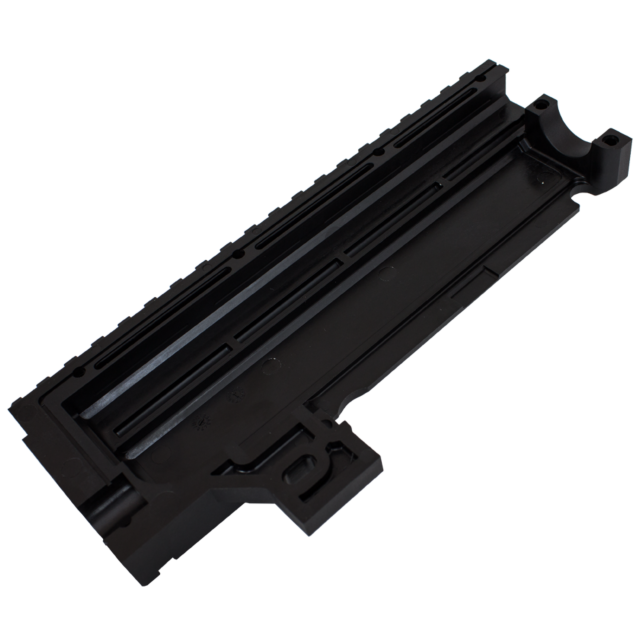The LEFT RECEIVER COVER EVO 3 S1 SEMI AUTO BLACK is a black plastic component featuring multiple ridges and grooves, with a rectangular shape and an open section at one end. Its technical, industrial design suggests it is part of the larger mechanical or