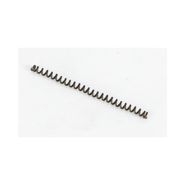 A close-up image of a small, black EJECTOR SPRING BREN 2 coiled metal spring lying on a plain white background, oriented horizontally across the image.