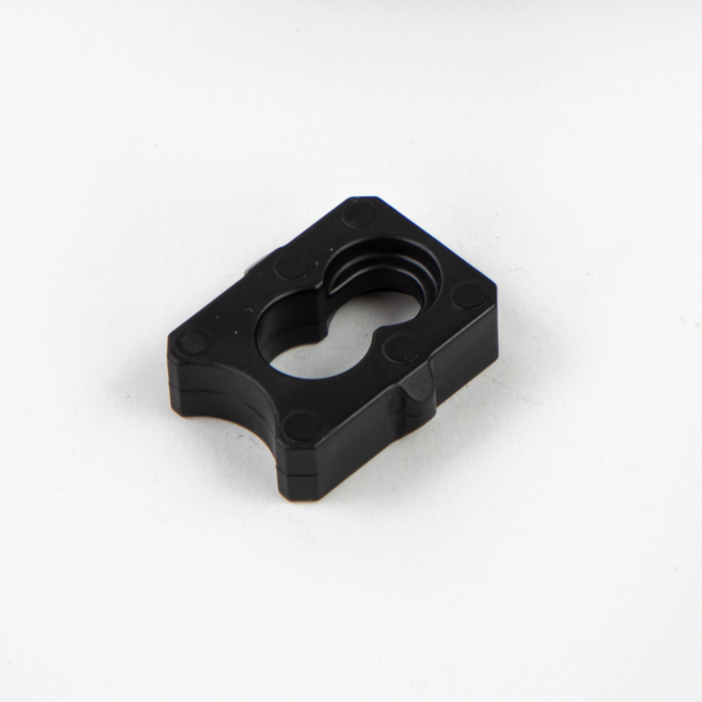 On a plain white background lies the BUFFER BREN 2, a black rectangular plastic component featuring rounded edges and a central cutout.