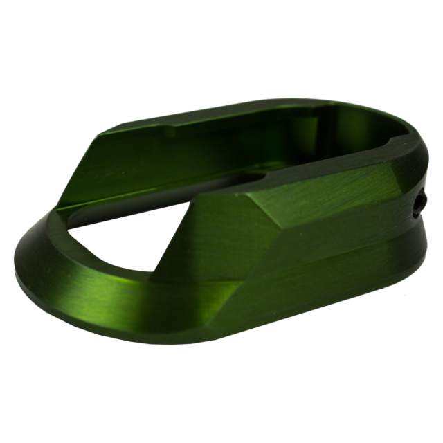 A piece resembling a mechanical component, featuring an angular aluminum design and a hollow rectangular opening, identified as the Aluminum Magwell Shadow 2 Green, is set against a white background.