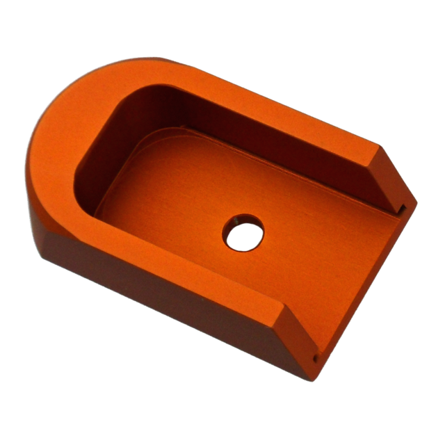 The ORANGE ALUMINUM 40P/SP-01 BASE PAD is an orange metal U-shaped bracket with a central hole, designed to securely hold or support objects. Its sleek, polished finish and sturdy construction make it ideal for various industrial or mechanical application