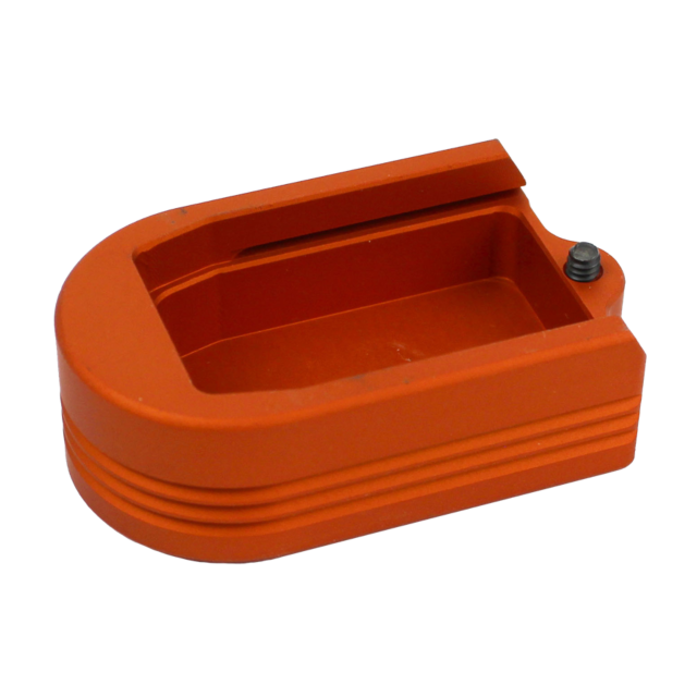 The HENNING EXTENDED MAGAZINE BASE P-10 PLUS 2 in orange is a rectangular plastic object with rounded edges and side grooves. It includes an open slot on top and a small black button or protrusion on one end for enhanced functionality.