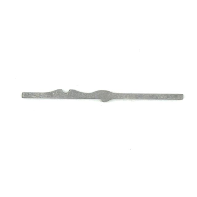 The 512 FIRING PIN NEW STYLE is a flat, thin metal tool with notches and curves along its length, shown on a white background.