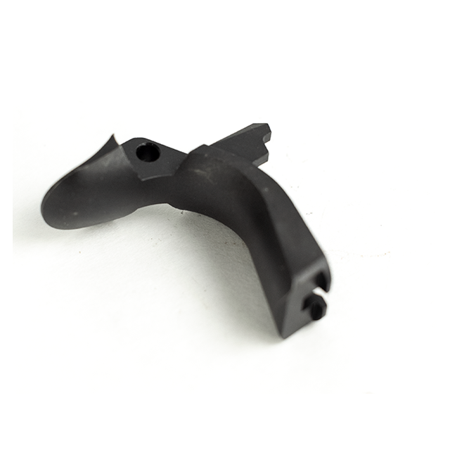A blue BEAVERTAIL GRIP SAFETY TACTICAL, crafted from plastic or metal in a curved shape with a hole and protruding tab, positioned on a white surface.