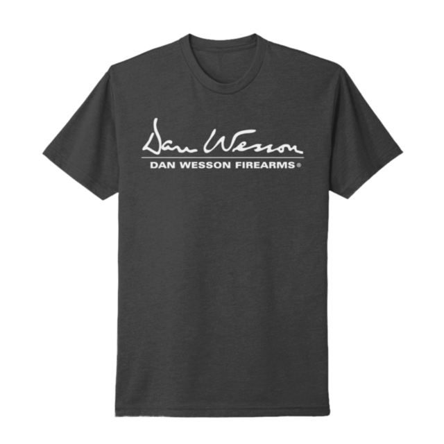 The Dan Wesson Charcoal Logo Tee 2X is a black T-shirt with "Dan Wesson" in white script above "DAN WESSON FIREARMS" in bold, capital letters, centered on the chest.