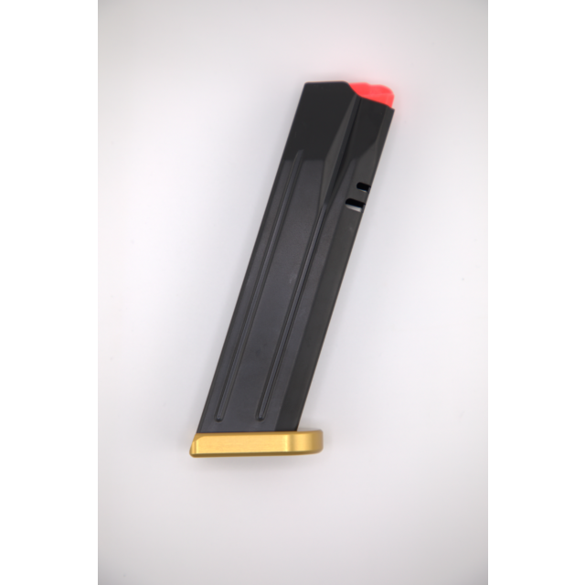 The MAG P10 F COMP READY, DWX Full 9MM 19RD GOLD BASE is shown on a white background, featuring a sleek black finish with a striking golden base and a red follower.
