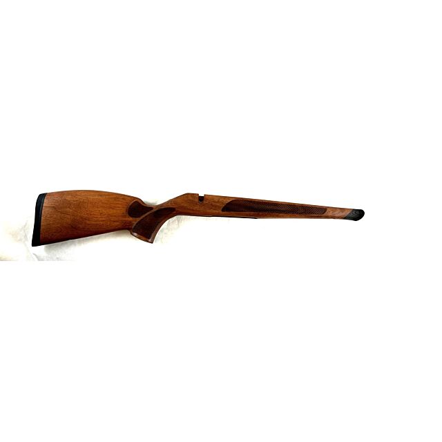 The "Stock CZ 600 Lux Med" is a wooden rifle stock with a dark finish, featuring an ergonomic design and textured grip area, isolated on a white background.