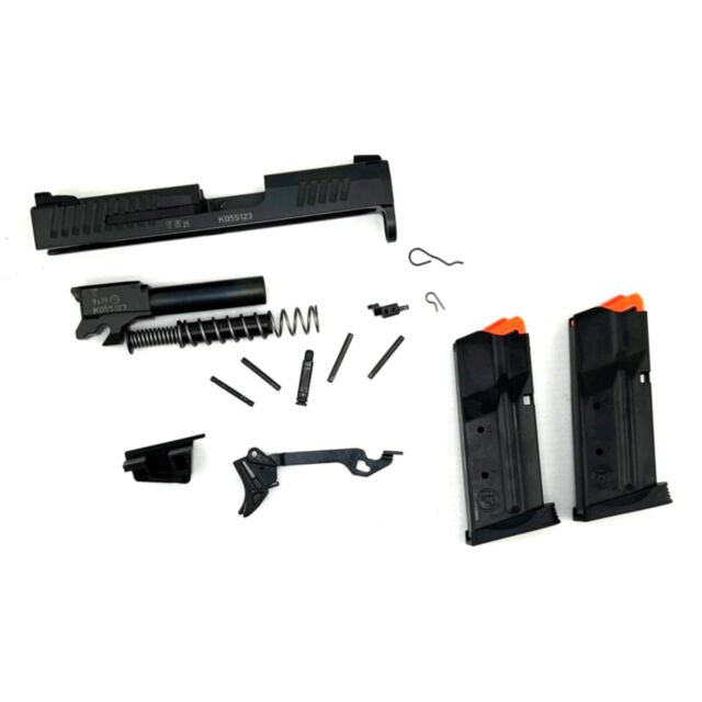 The P10-M Spare Parts Kit, including the slide, barrel, recoil spring, pins, springs, magazines with orange tips, and other small components, is displayed disassembled on a white background.