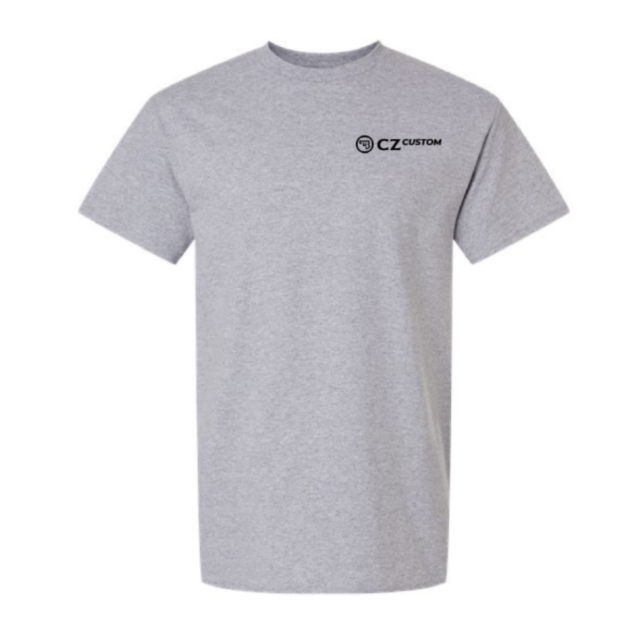 The CZ CUSTOM LOGO SHIRT XL features a plain light gray design with short sleeves and a small black “CZ CUSTOM” logo and emblem on the left chest, making it an ideal choice for those who prefer a simple yet distinctive custom logo style.